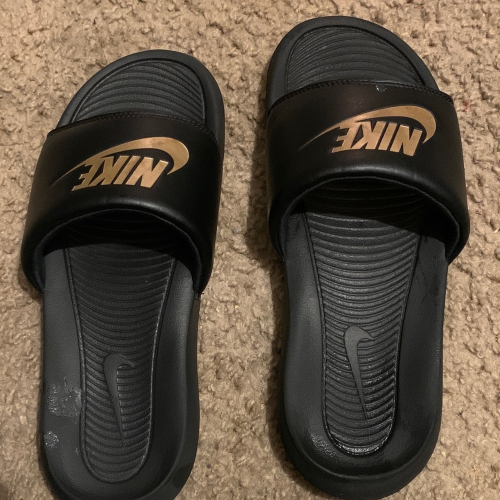Nike Black Slides with Metallic Gold Swoosh